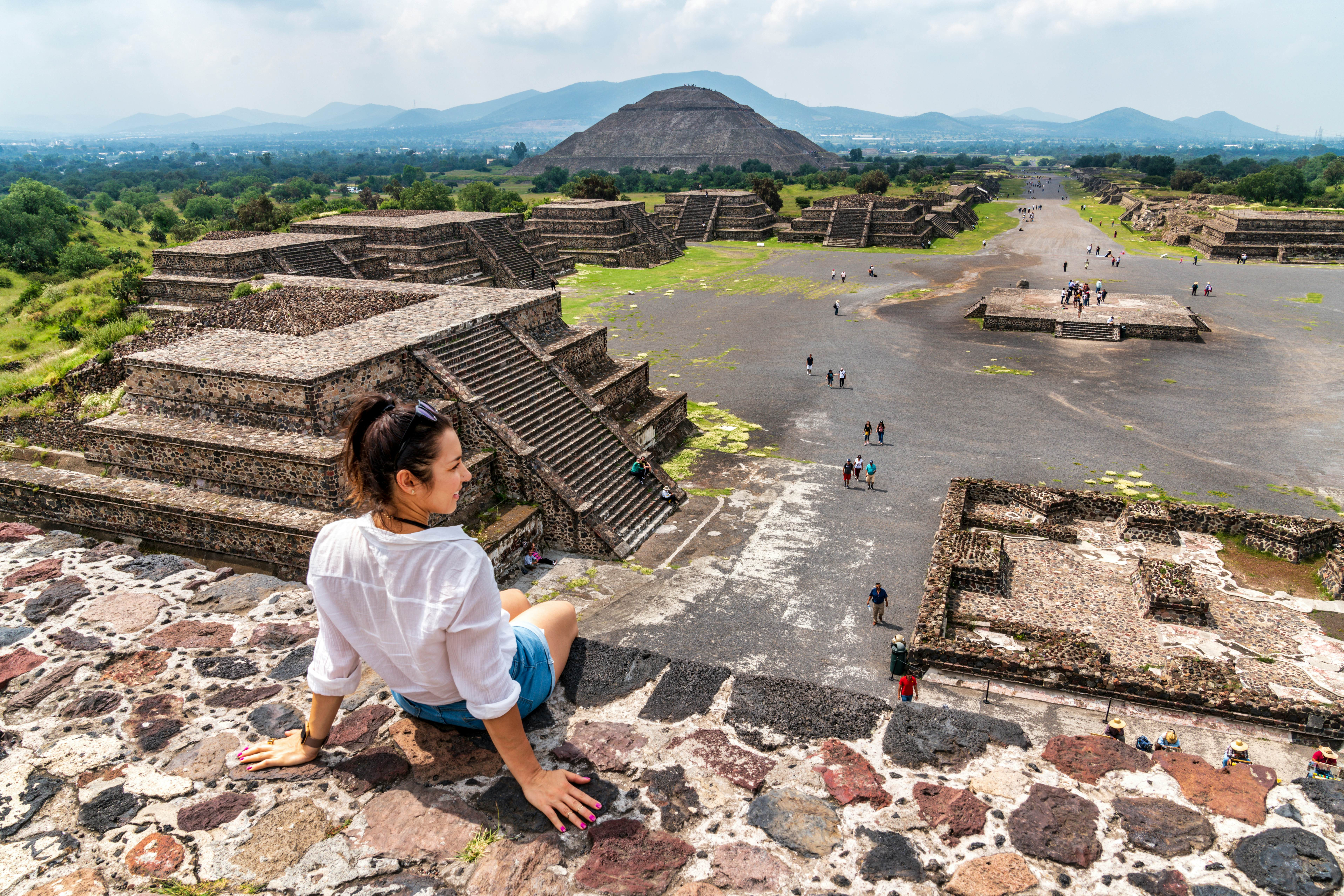 Woman atop a pyramid at Teotihuacán, Mexico