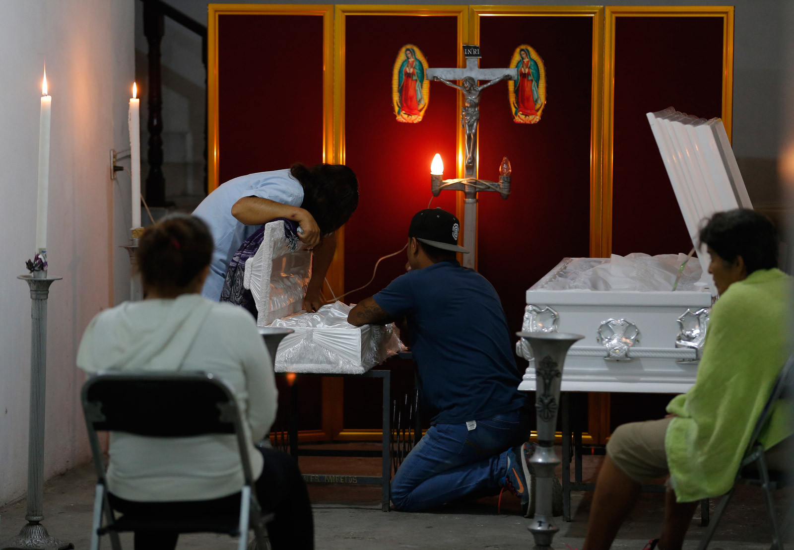 Family members attend a wake for toddler Daniel Novoa and his aunt Marta Cruz after they were killed in Jojutla, Mexico, following the earthquake