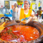 Serving barbacoa in a market