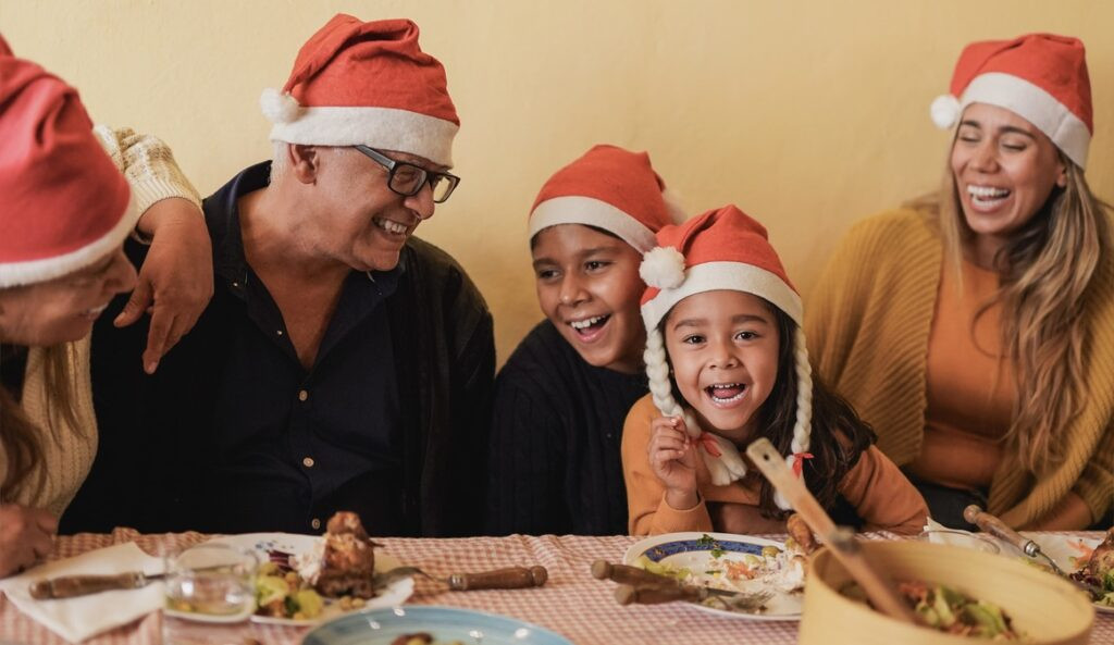 family-with-santa-hats-celebrating-christmas-in-mexico