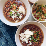 Close up of clay pot with beans cooking