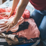Packing for Cabo San Lucas: Clothing essentials displayed on a surface.