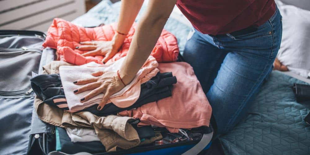 Packing for Cabo San Lucas: Clothing essentials displayed on a surface.