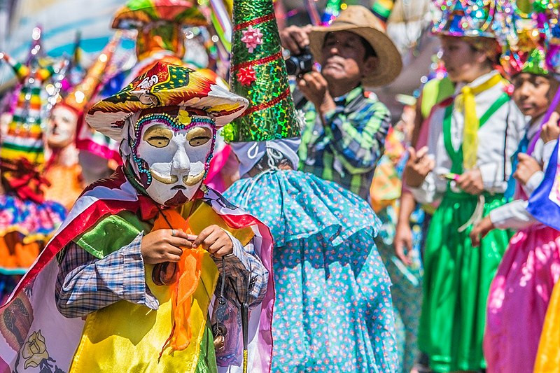 Intricately designed sawdust carpets known as alfombras in Mexico during Holy Week, showcasing religious symbolism and the artistic talent of local communities with their colorful patterns.