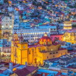 Colorful buildings in Guanajuato, Mexico, reflecting the strong dollar's value