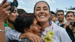 Claudia Sheinbaum smiling during a campaign rally