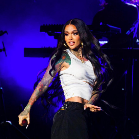 Kehlani posing for a photo, showcasing her unique style and confidence