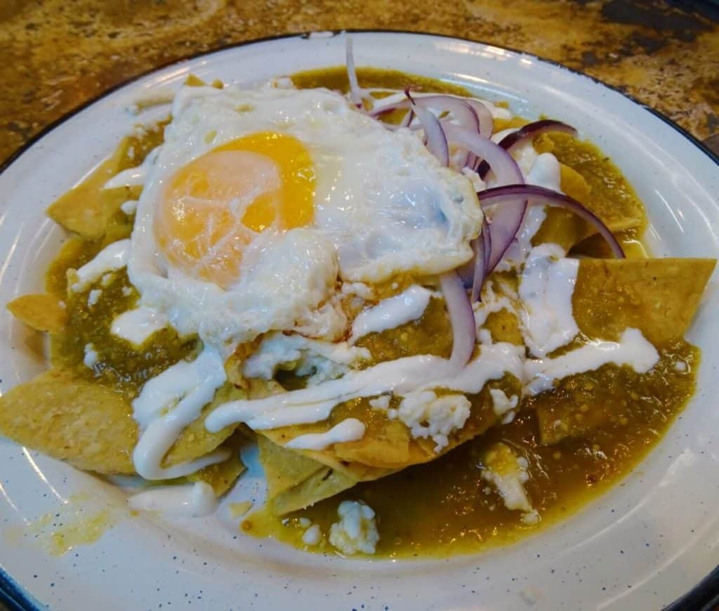 A delicious plate of chilaquiles, a popular Mexican breakfast dish.