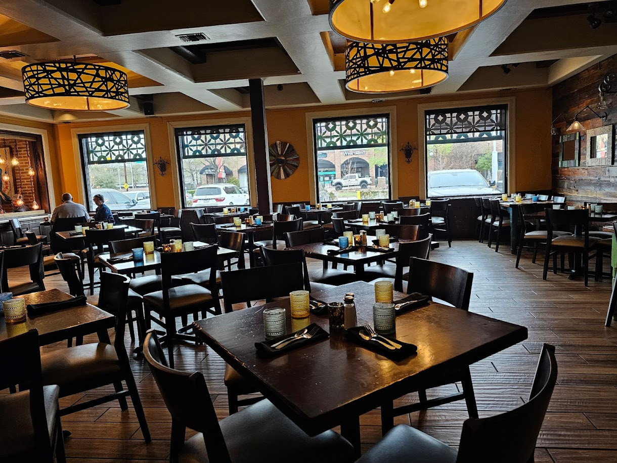 Uncle Julio's Lemmon Ave features a rustic and inviting interior with a lively bar area.