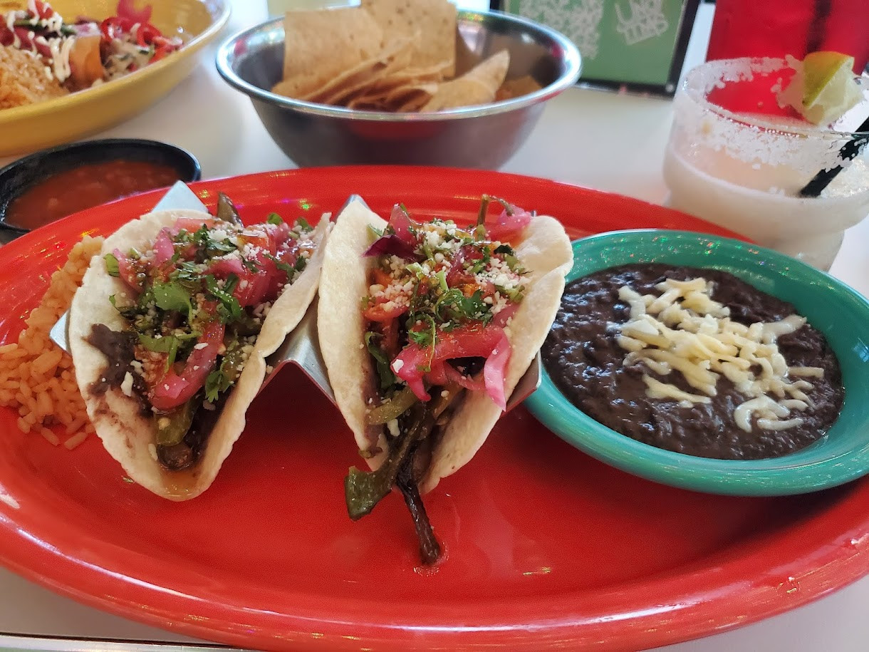 Uno Mas Tex Mex's brightly lit interior offers a modern and casual dining atmosphere.