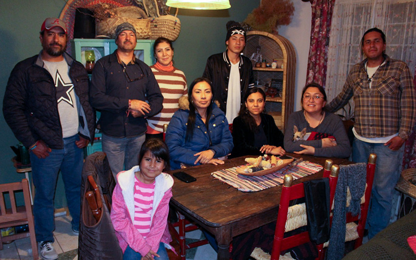 Apache community members in Chihuahua, Mexico, standing outdoors.