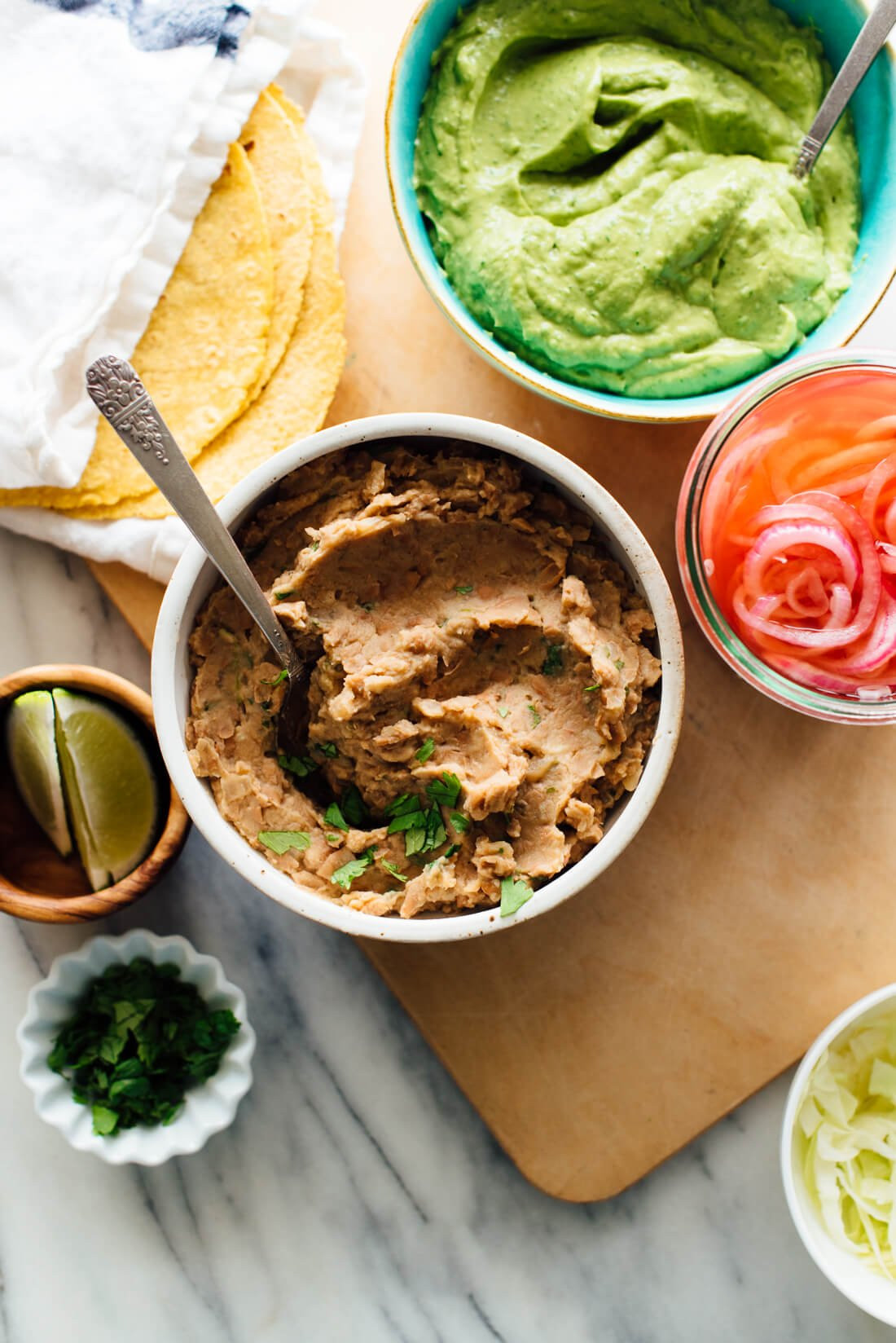A portion of refried beans served as a side dish in a Mexican restaurant