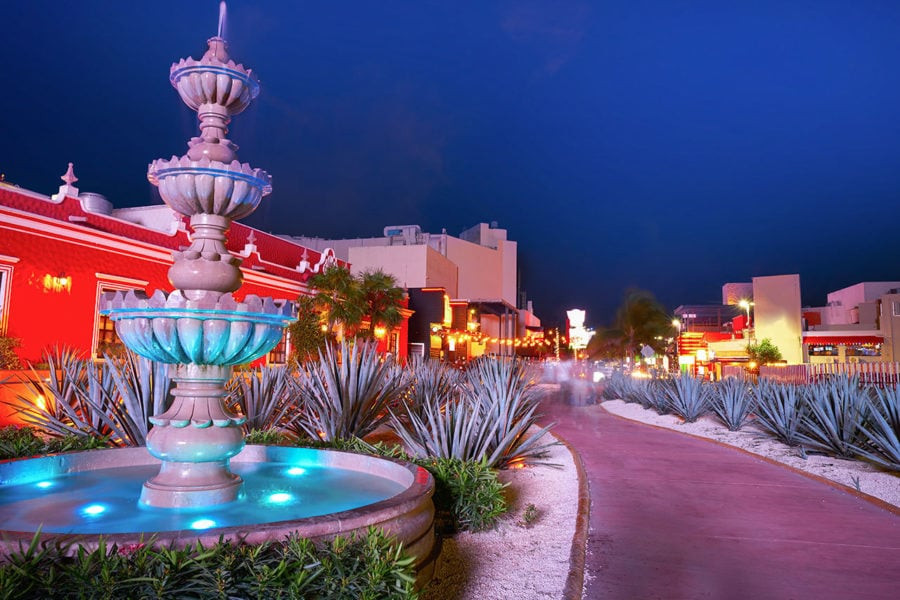 Cancun Hotel Zone at night with water fountain and walkways