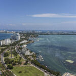 Cancun Hotel Zone view under a clear blue sky, representing the tourist-friendly environment.