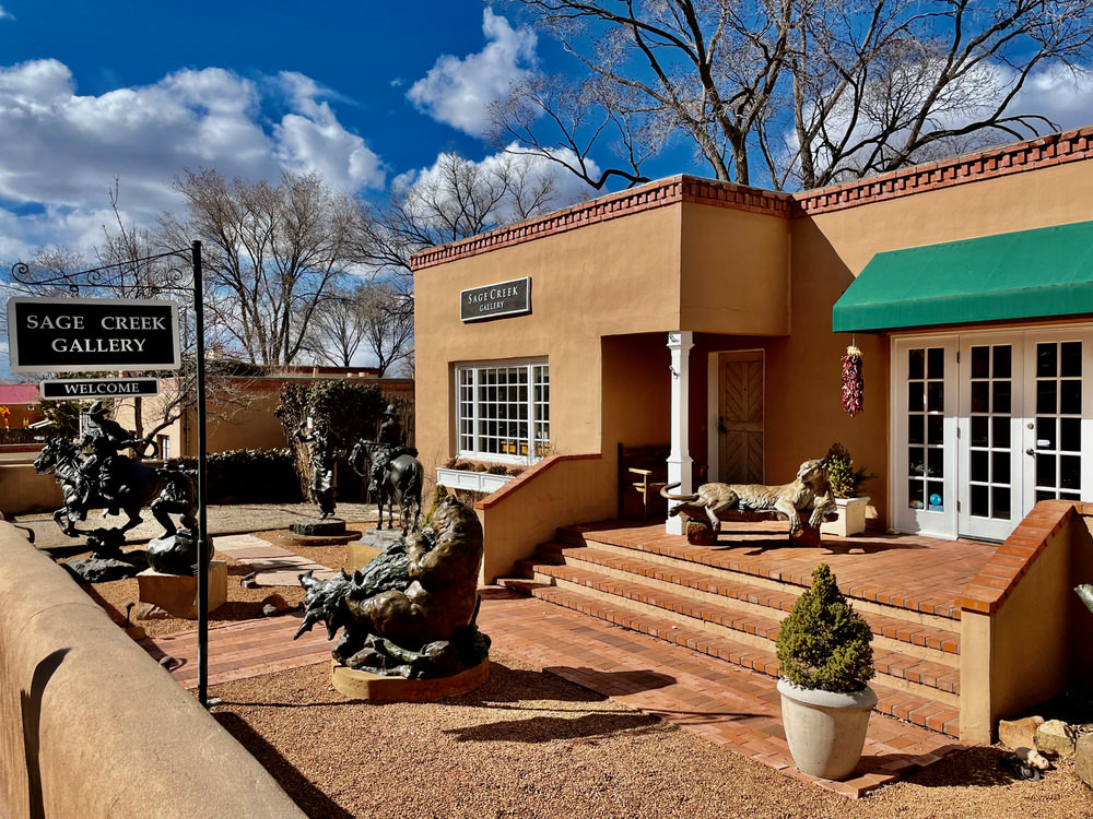 Canyon Road Galleries in Santa Fe New Mexico with colorful buildings and art displays