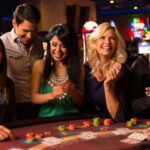Casino floor at Inn of the Mountain Gods, featuring slot machines and gaming tables.