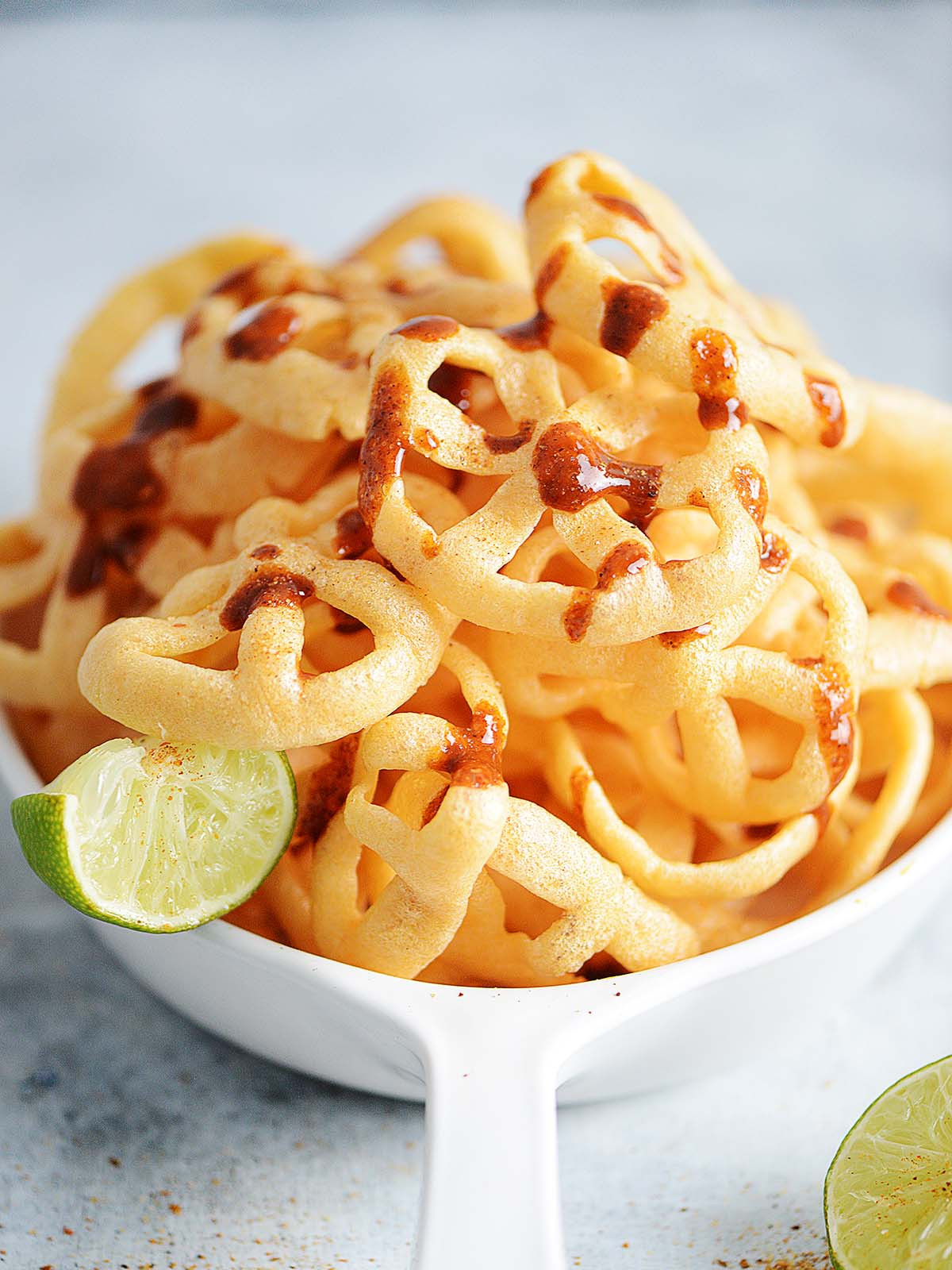 Chicharrones de harina drizzled with hot sauce