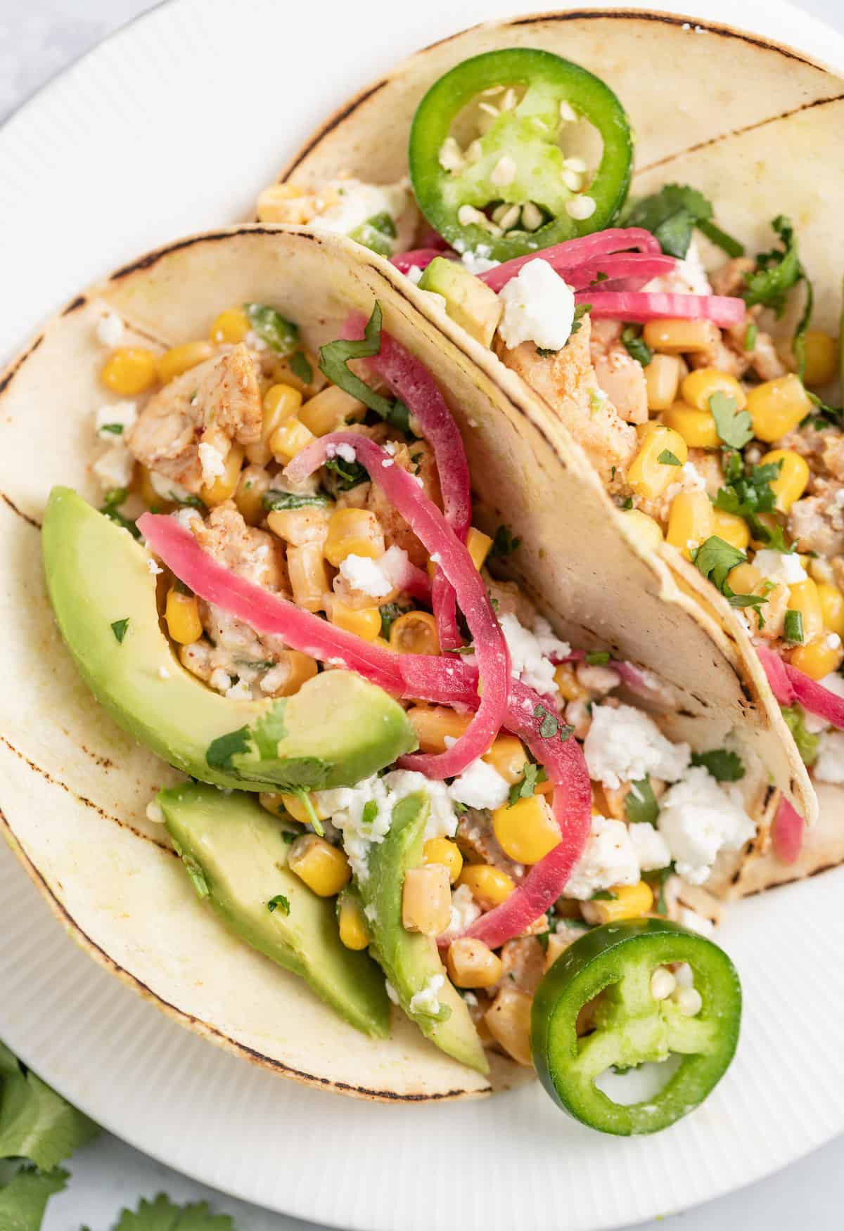 assortment of classic mexican street tacos with various fillings and toppings