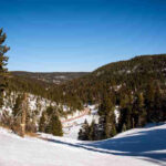 Ski Santa Fe offers diverse terrain, reliable snowfall, and a welcoming atmosphere for LGBTQ+ skiers and snowboarders.