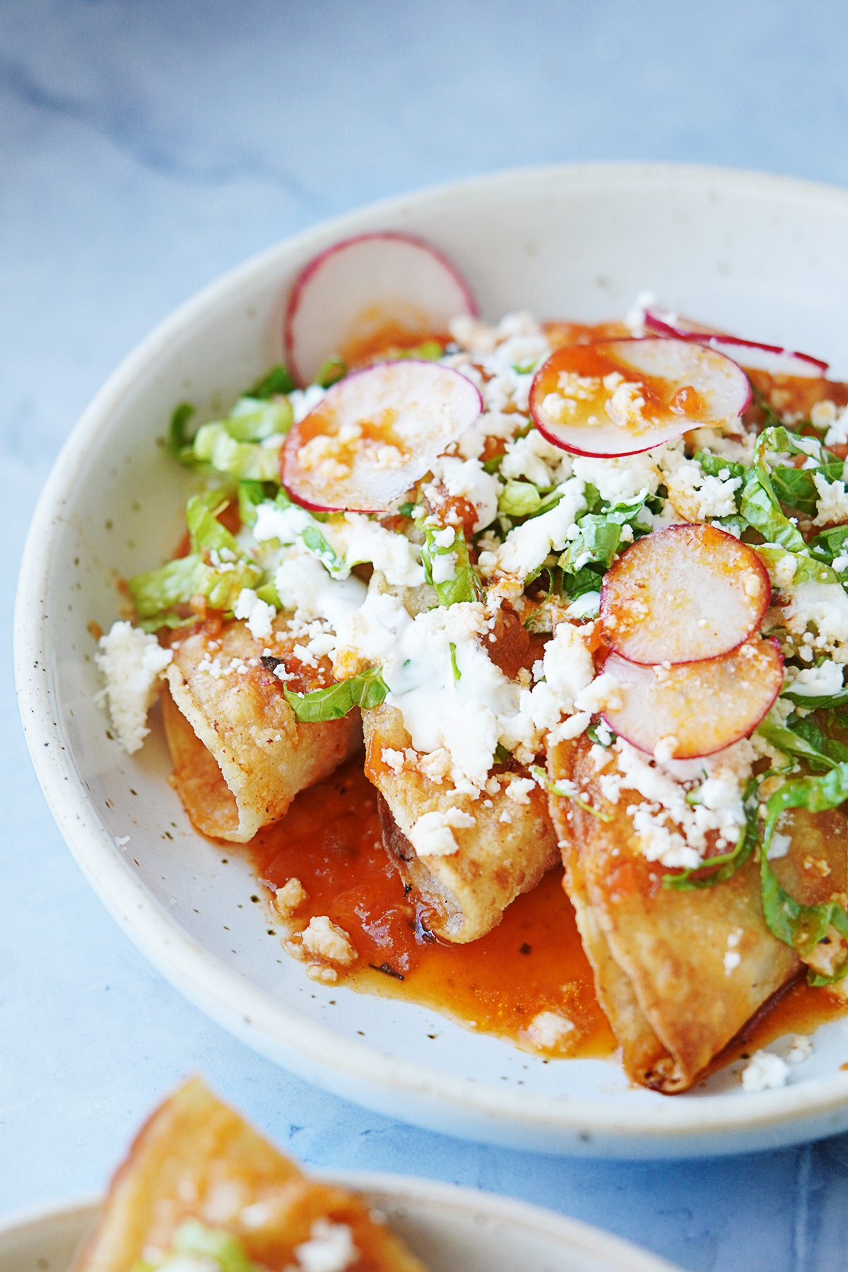 Tacos smothered in tomato consomé
