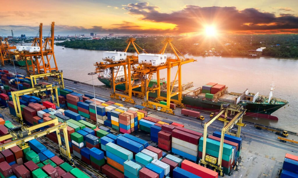 Vehicles in containers being loaded in a container ship to Mexico.