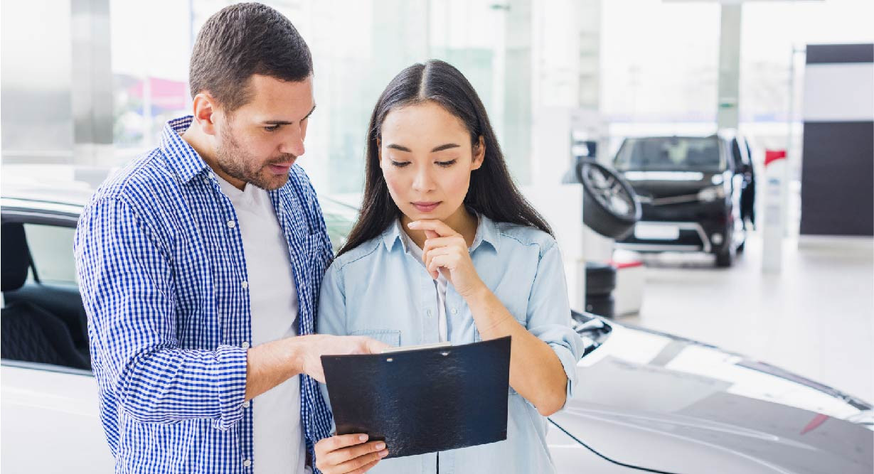 Couple at a car dealership in Mexico