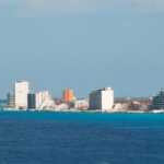 Aerial view of Cozumel coastline, showcasing its turquoise waters and white sandy beaches Cozumel's pristine coastline offers a haven for relaxation and adventure.