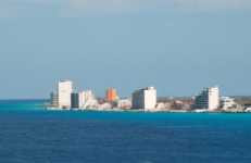 Aerial view of Cozumel coastline, showcasing its turquoise waters and white sandy beaches Cozumel's pristine coastline offers a haven for relaxation and adventure.