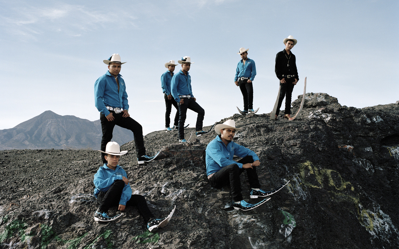 Members of &quot;Los Socios&quot; pointy boots crew, posing on the rest of an old mining field of Matehuala.