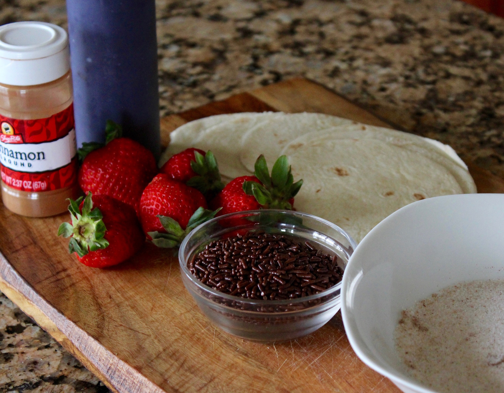 Delicious dessert tacos filled with ice cream, strawberries, chocolate syrup, and sprinkles, perfect for a Cinco de Mayo celebration