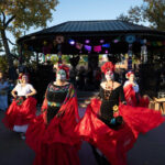 Dia de los Muertos celebrations on the Plaza in Santa Fe, New Mexico, featuring colorful decorations and traditional costumes