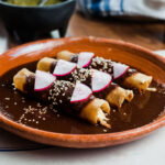 Chicken enmoladas covered with mole poblano