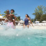 Family enjoying a sunny day on a Mexico cruise, highlighting the joy and relaxation of the vacation.