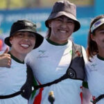 The archery team poses for a photo