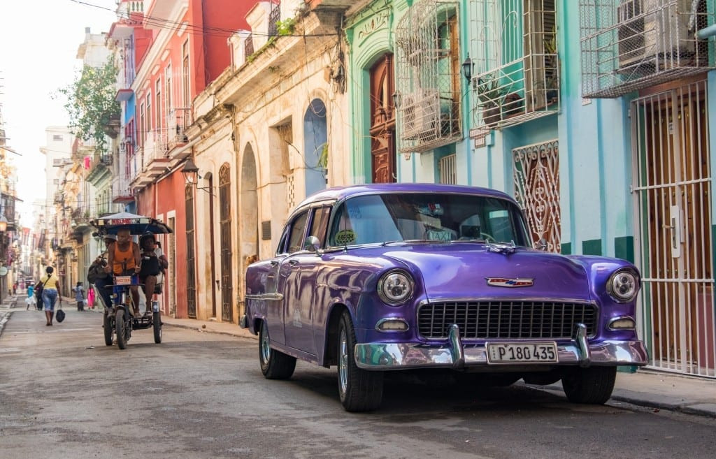 Purple classic car in Cuba