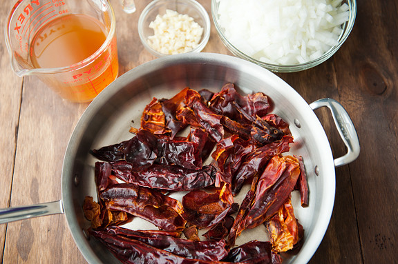 toast the chiles, chop the garlic and onions