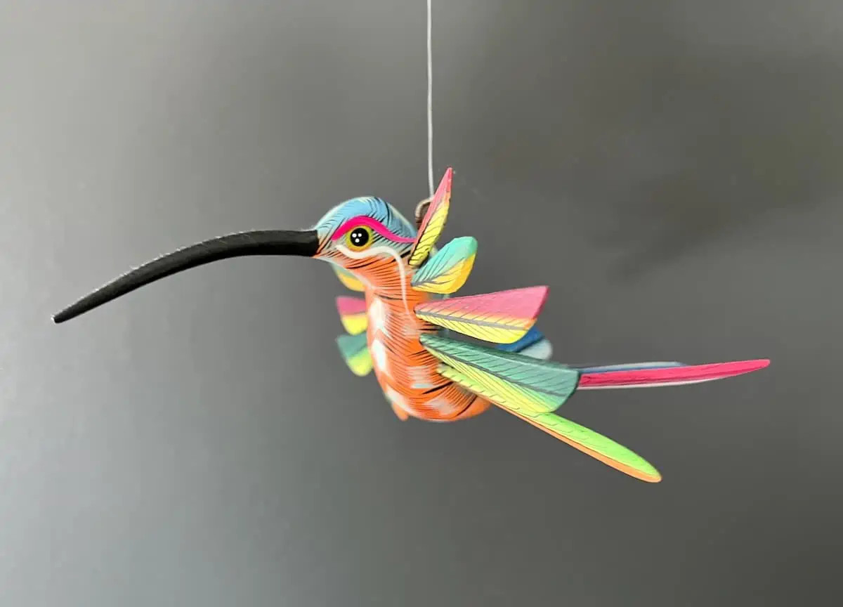 A vibrant hummingbird alebrije in Huatulco