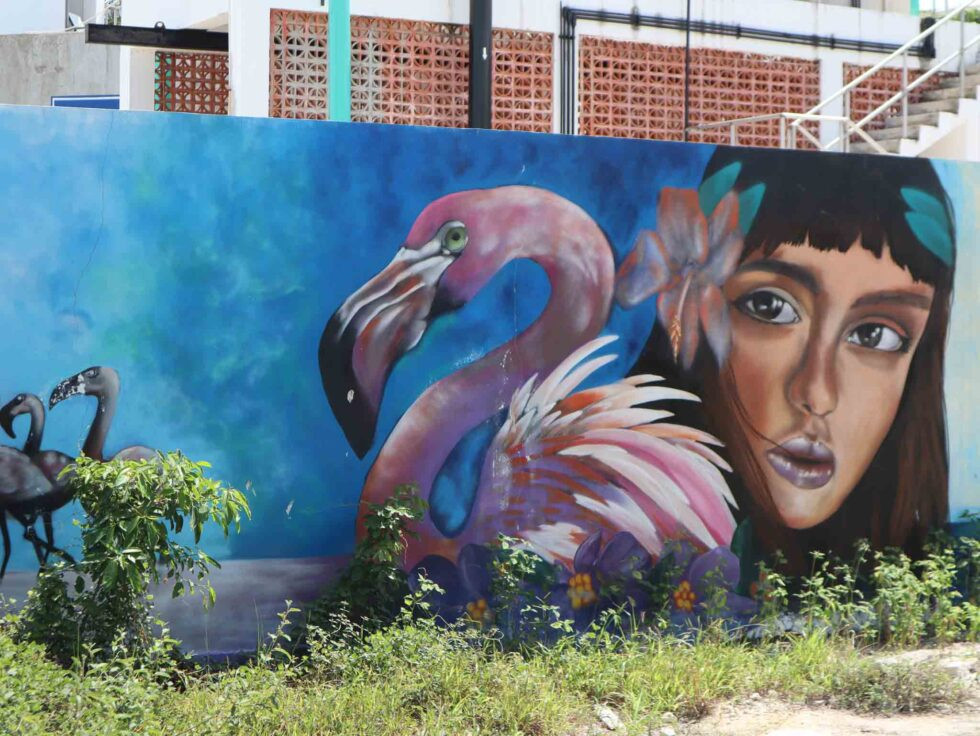 Vibrant street art in Puerto Morelos, Mexico, enhancing the town's colorful and inviting atmosphere