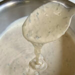 homemade crema mexicana with fresh cilantro and lime