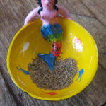 Cumin seeds in a coconut shell bowl