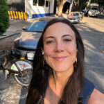 woman with brown hair smiling at camera for is it safe in Mexico City