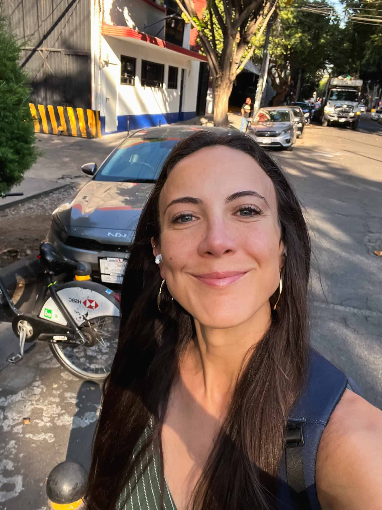 woman with brown hair smiling at camera for is it safe in Mexico City