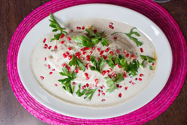 Chiles en Nogada dish beautifully plated with garnish