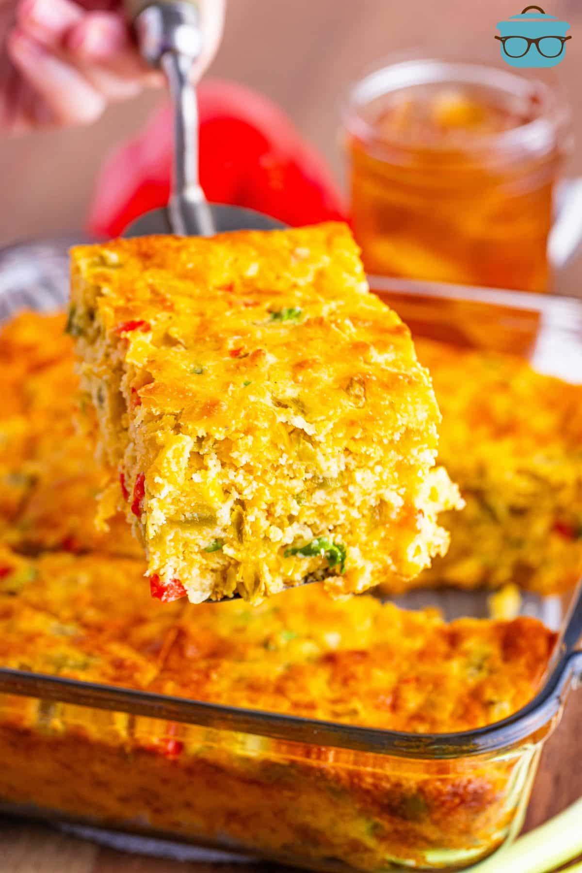 Mexican Cornbread with a utensil cutting a slice.