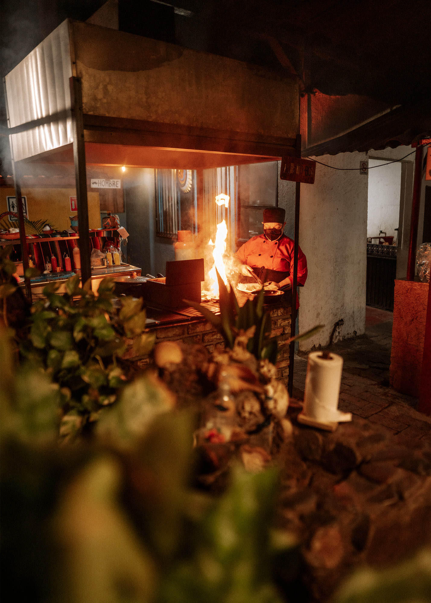 Chef Carmen at Casa Carmen's Restaurant in Loreto, preparing traditional dishes.