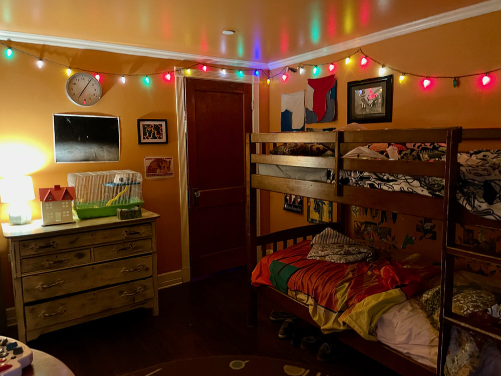 Meow Wolf Bedroom in the House of Eternal Return Santa Fe with colorful lights and art installations