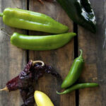 overhead shot of a variety of mexican chiles types (aka chilis)