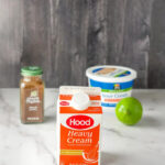 Ingredients for Mexican Crema including heavy cream, lime, sour cream, and chipotle powder