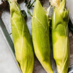 Grilled corn on the cob, ready for elotes seasoning