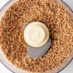 Finely chopped pecans in a food processor
